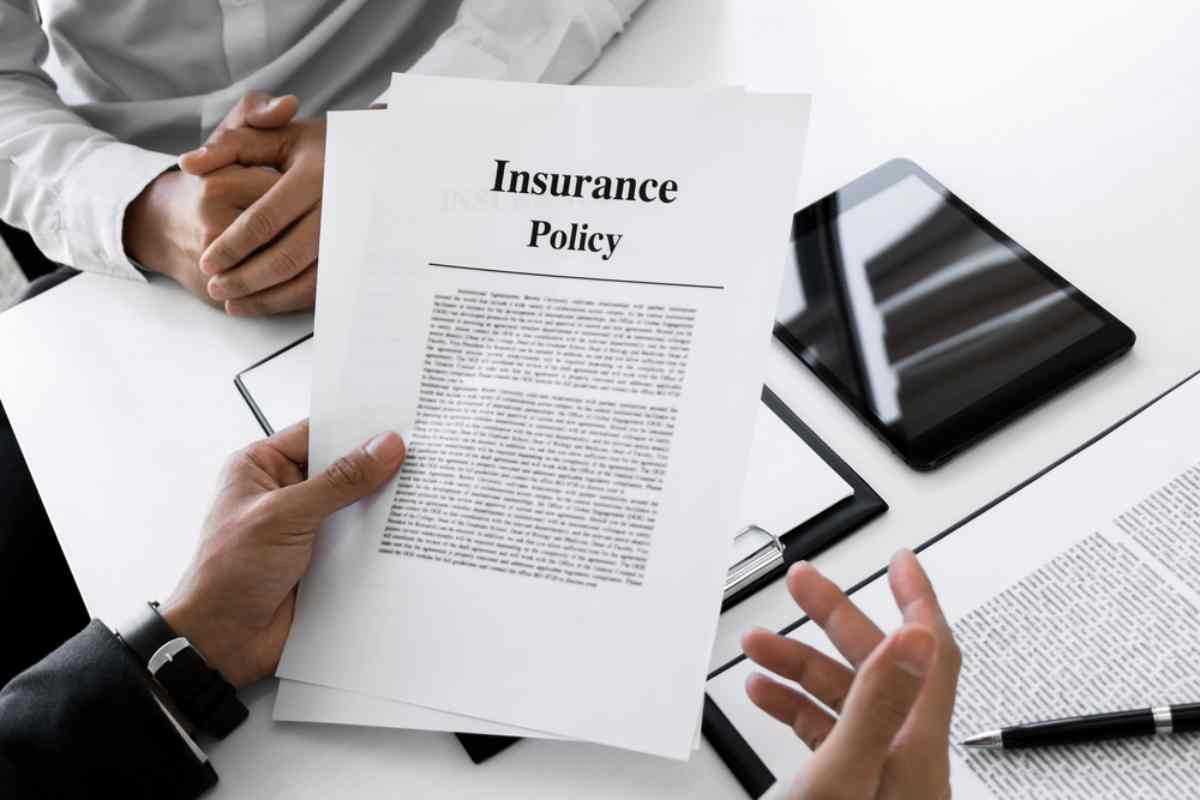 A person holds a blank document with the phrase 