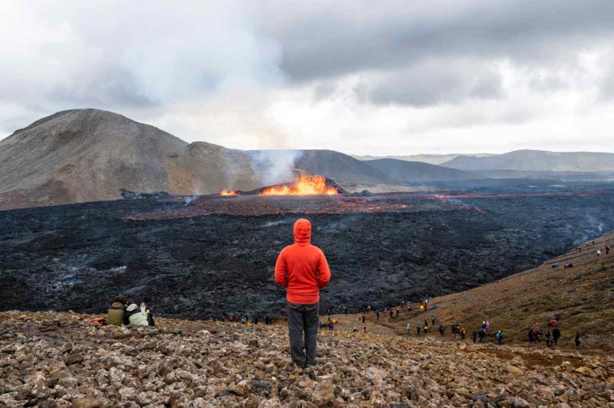 Tourist by a volcanic active area