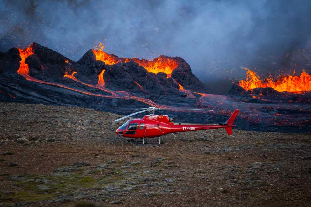 Helicopter tour coming closer to an active volcano area