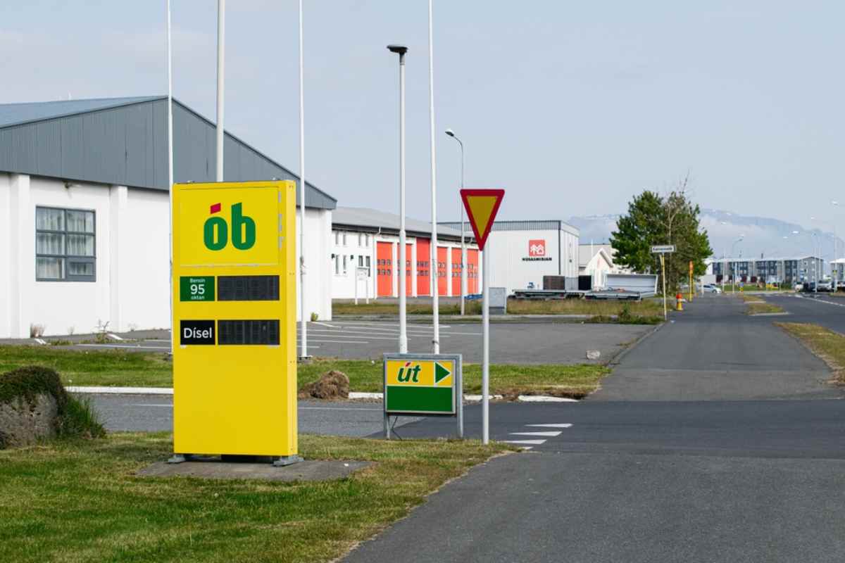 Yellow OB gas station price sign with diesel and 95 octane fuel in Iceland.